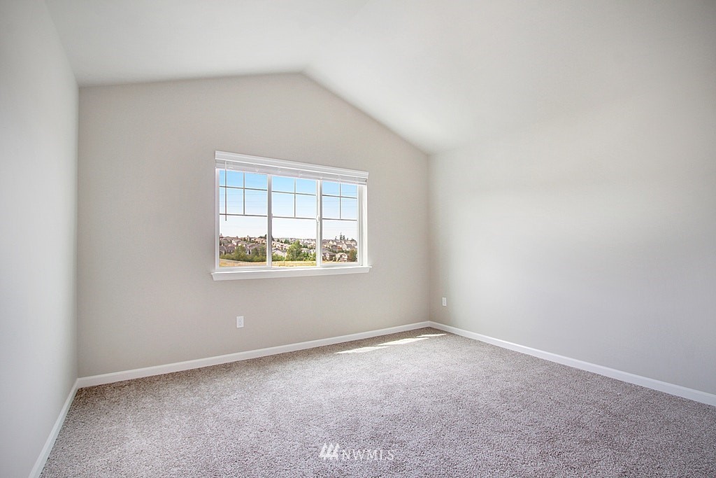 5202 Northeast 24th Street Renton, WA 98059 - Photo 18 of 22 an empty room with windows