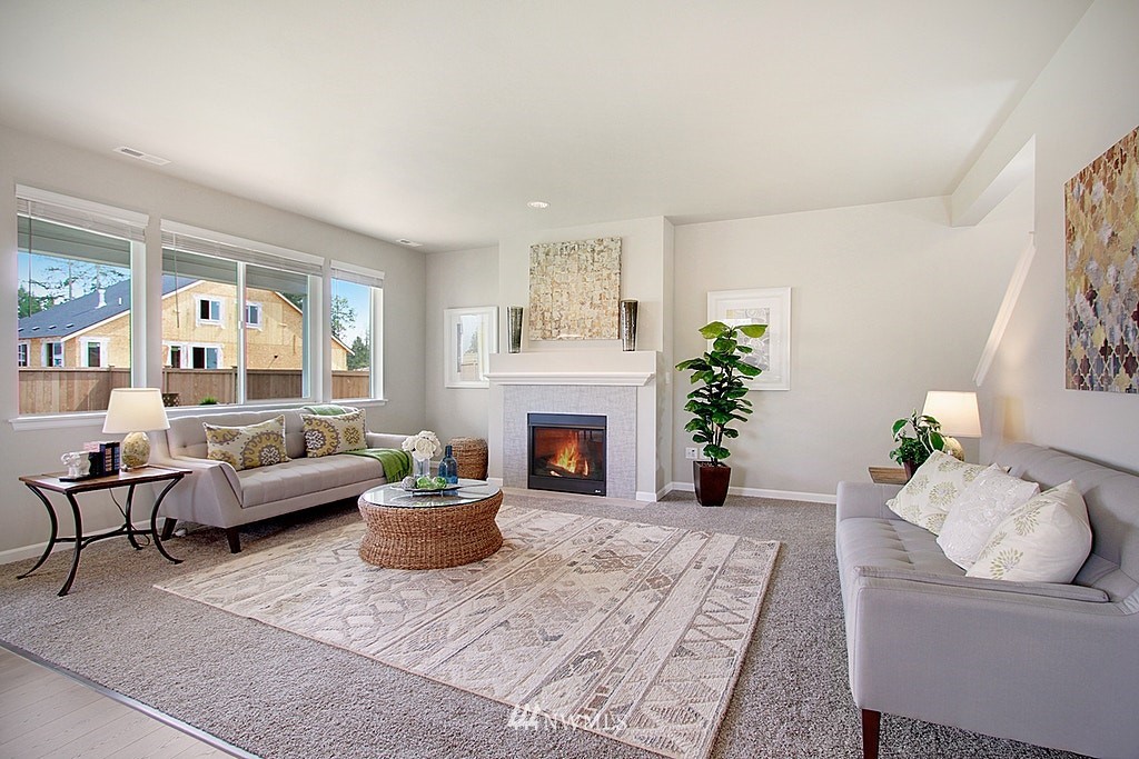 5202 Northeast 24th Street Renton, WA 98059 - Photo 5 of 22 a living room with furniture and a fireplace