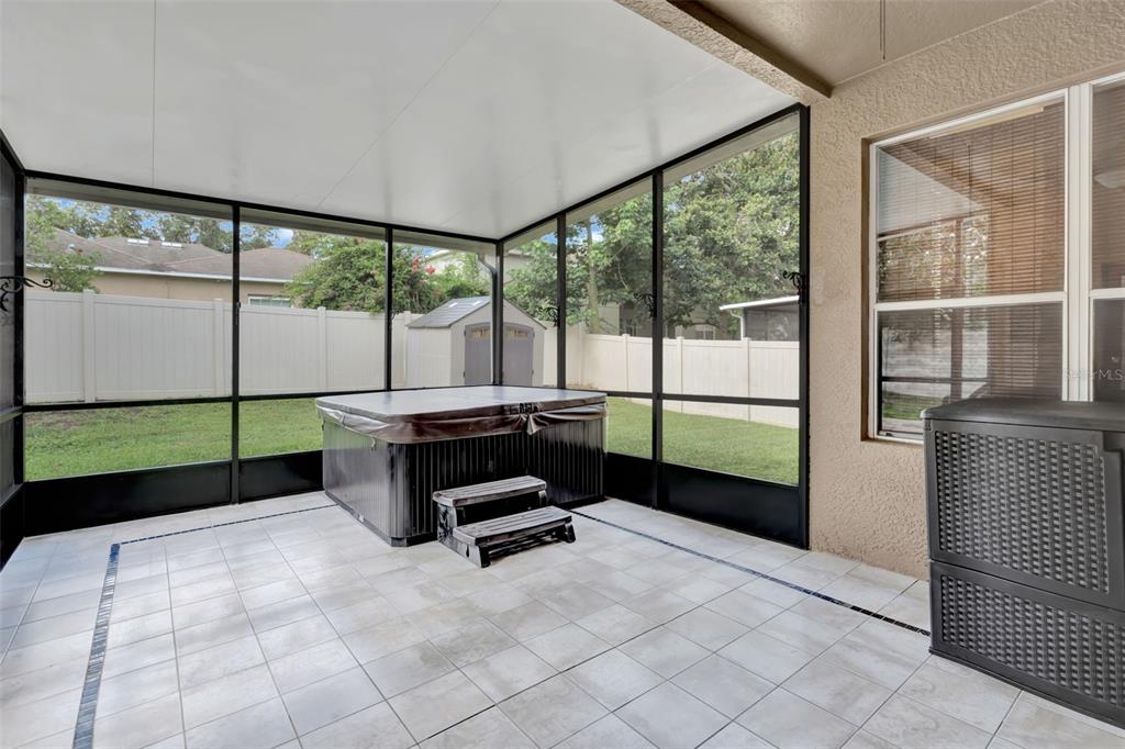 6932 Gray Catbird Loop Wesley Chapel, FL 33545 - Photo 23 of 25 a living room with a large window