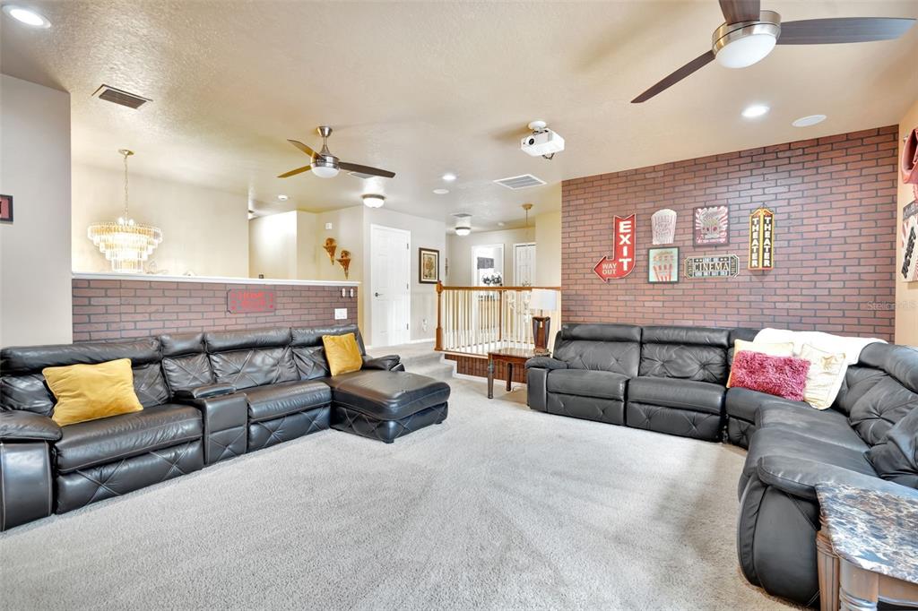 6932 Gray Catbird Loop Wesley Chapel, FL 33545 - Photo 9 of 25 a living room with furniture and a couch