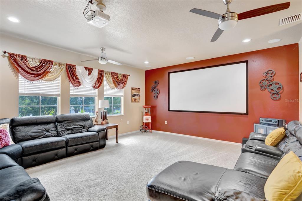 6932 Gray Catbird Loop Wesley Chapel, FL 33545 - Photo 10 of 25 a living room with furniture and a large window