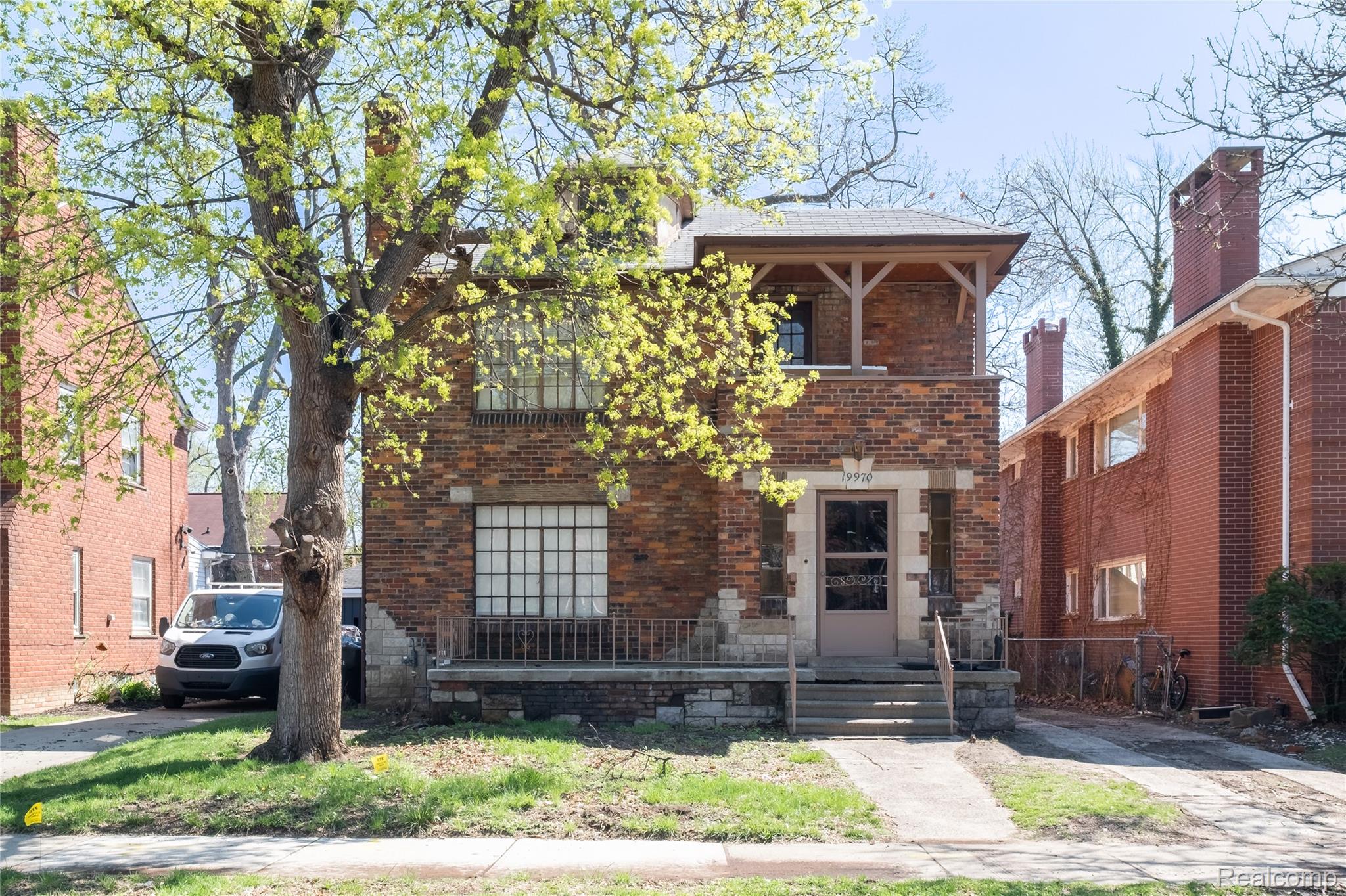 19970 Stratford Road Detroit, MI 48221 - Photo 1 of 27 View of front facade featuring brick siding and a balcony