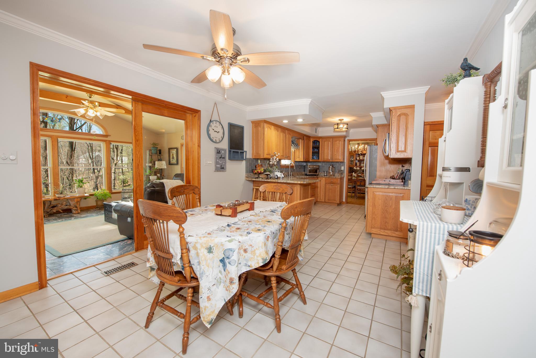 8524 Reservoir Road Fulton, MD 20759 - Photo 10 of 49 Eat-in kitchen with views to kitchen and sun porch