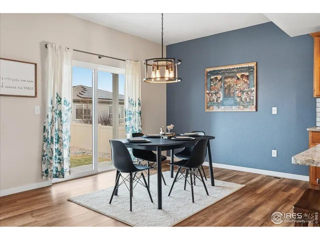 a bathroom with a toilet and a shower curtain