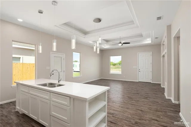 a bathroom with a sink mirror and a bathtub