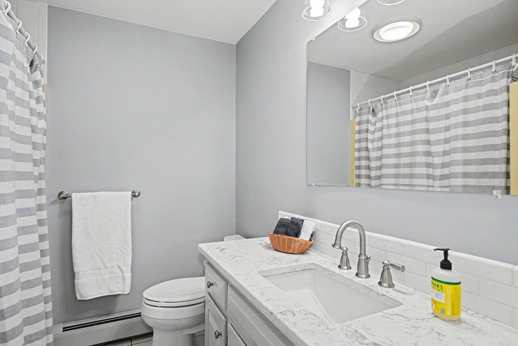 15 Lanthorn Road Northborough, MA 01532 - Photo 26 of 37 a bathroom with a granite countertop sink and a toilet