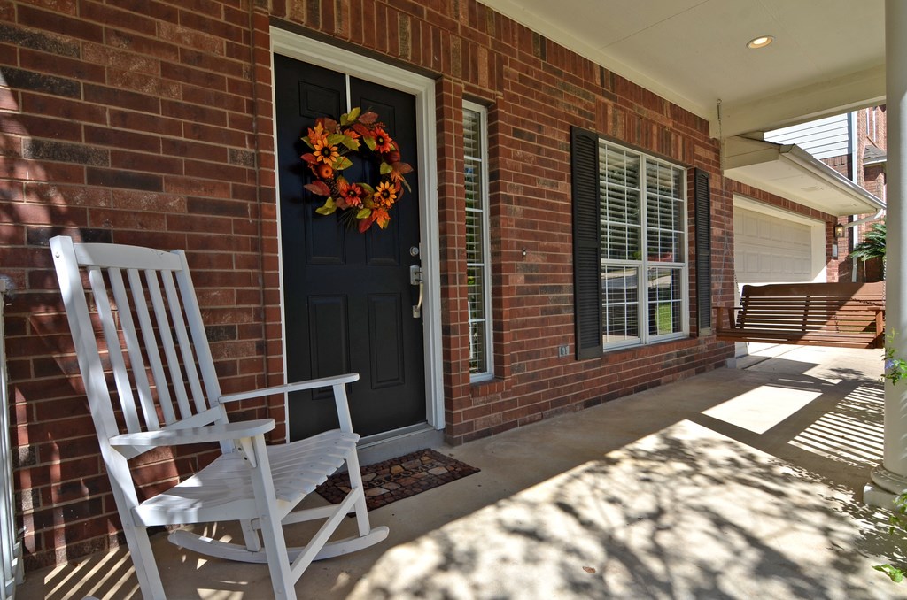 a view of a porch with a bench