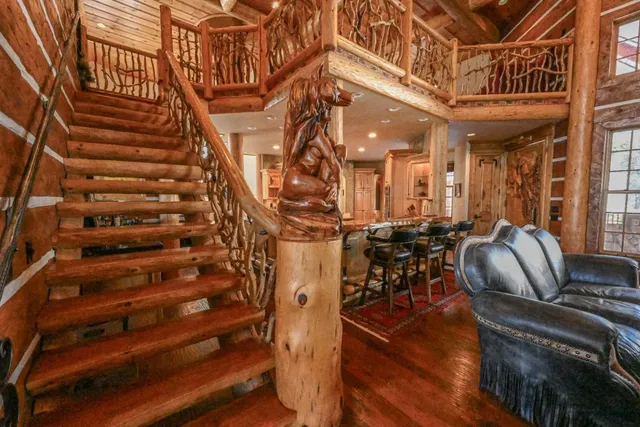 a view of kitchen with granite countertop a table and chairs