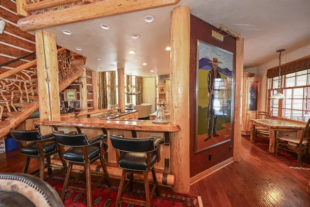 a view of a living room and floor to ceiling window