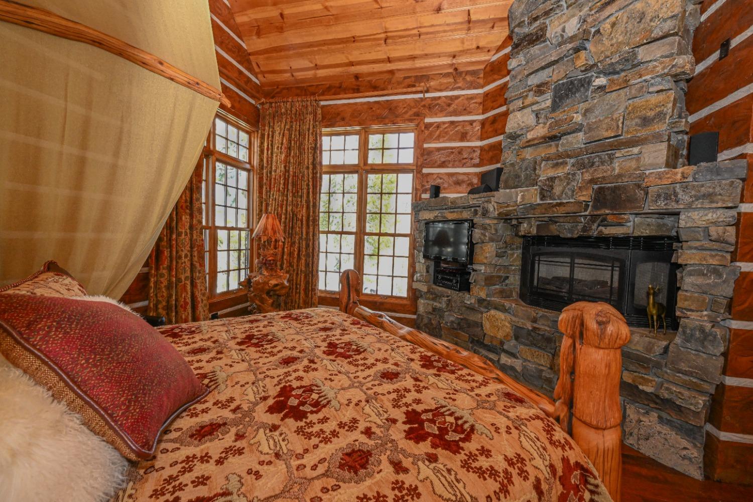 42433 Pinnacle Lane Shaver Lake, CA 93664 - Photo 29 of 64 a bed sitting in a bedroom next to a window