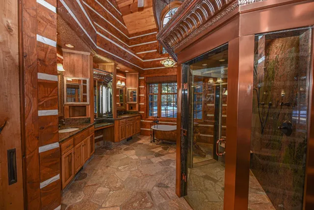 a bathroom with a tub and shower