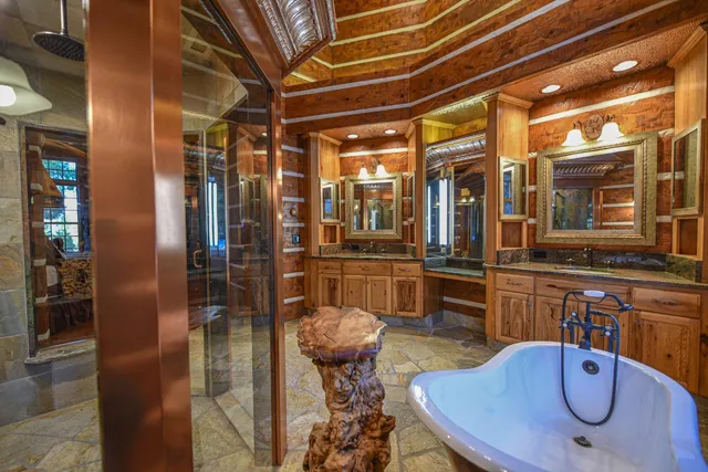 a bed sitting in a room next to a window