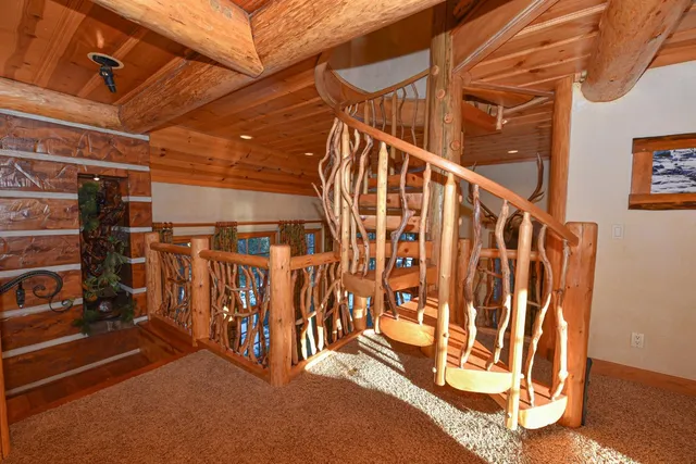 a large room with a bed and a window