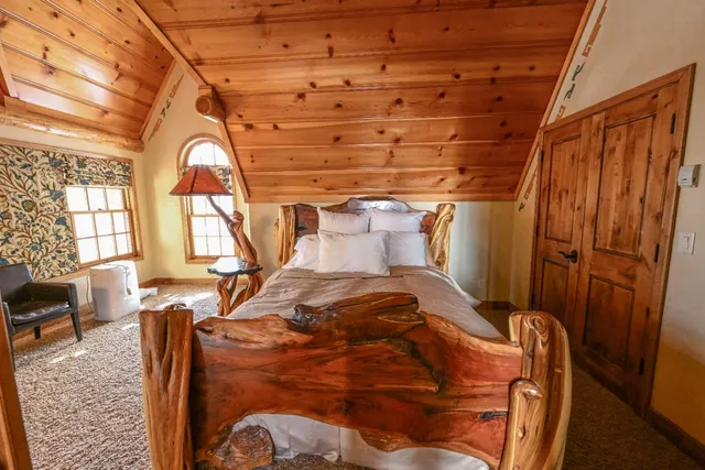 a living room with stainless steel appliances granite countertop a stove and a refrigerator