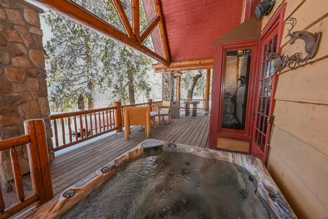a bathroom with a granite countertop toilet a sink and a shower
