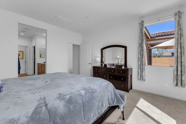 a bed room with a bed and a television