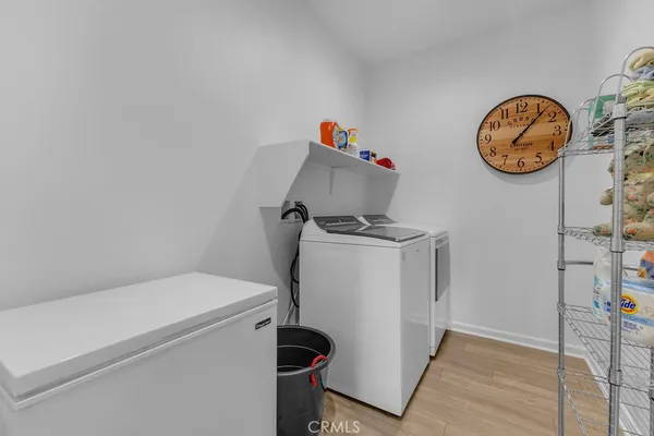 a view of storage and utility room with a washer and dryer