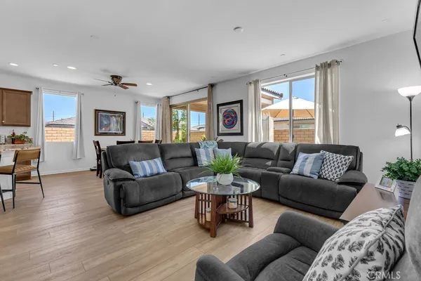 a living room with furniture and windows