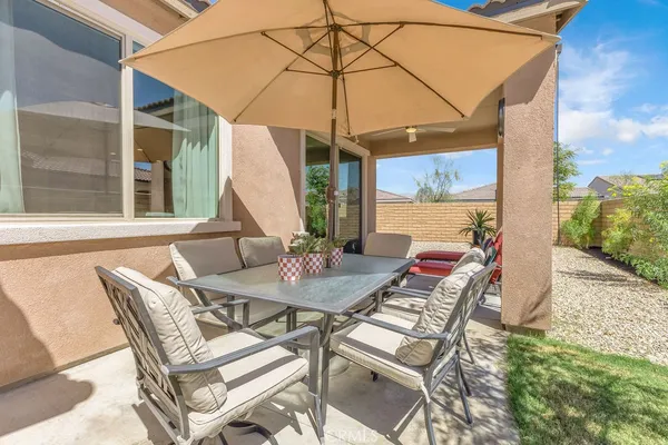 a view of an outdoor sitting area with furniture