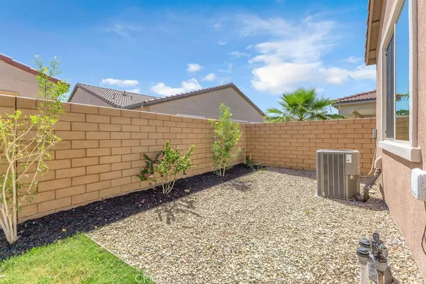 a pathway of a house with a yard