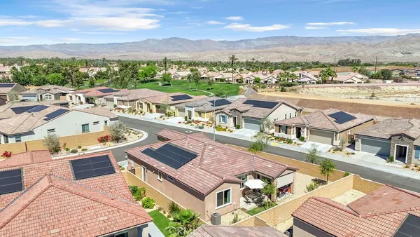 a view of a city with lawn chairs