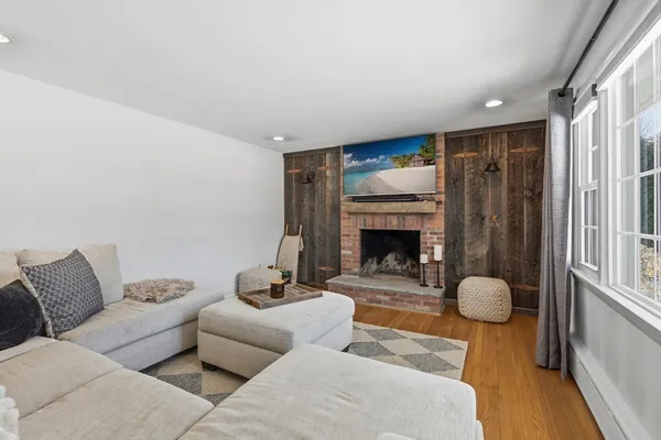 a living room with furniture and a fireplace