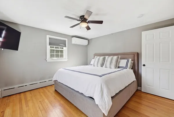 a bedroom with a bed and window