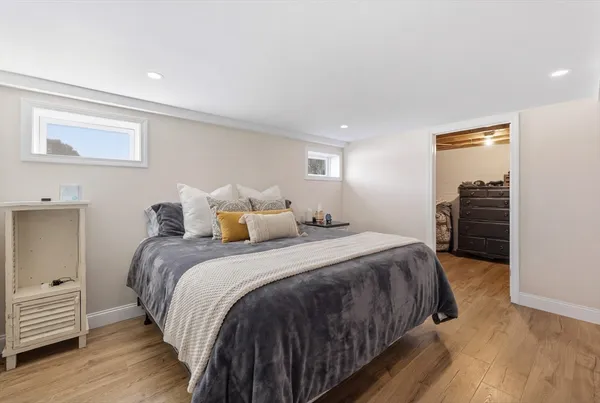 a bed room with a bed and wooden floor