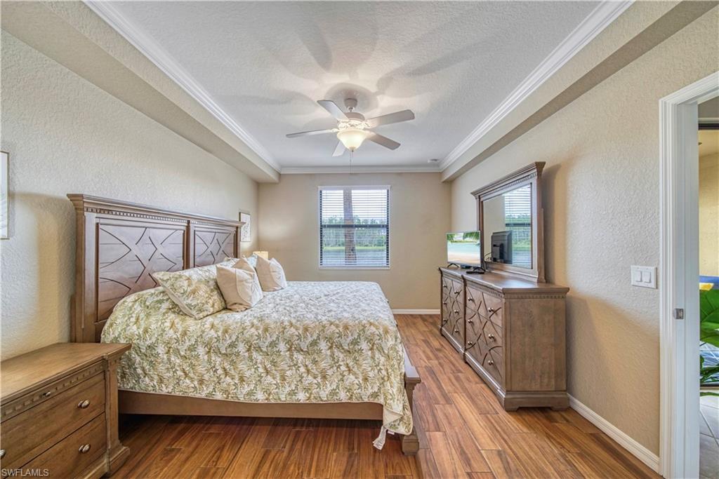 9560 Trevi Court, Unit 4815 Naples, FL 34113 - Photo 17 of 38 a living room with furniture and a window