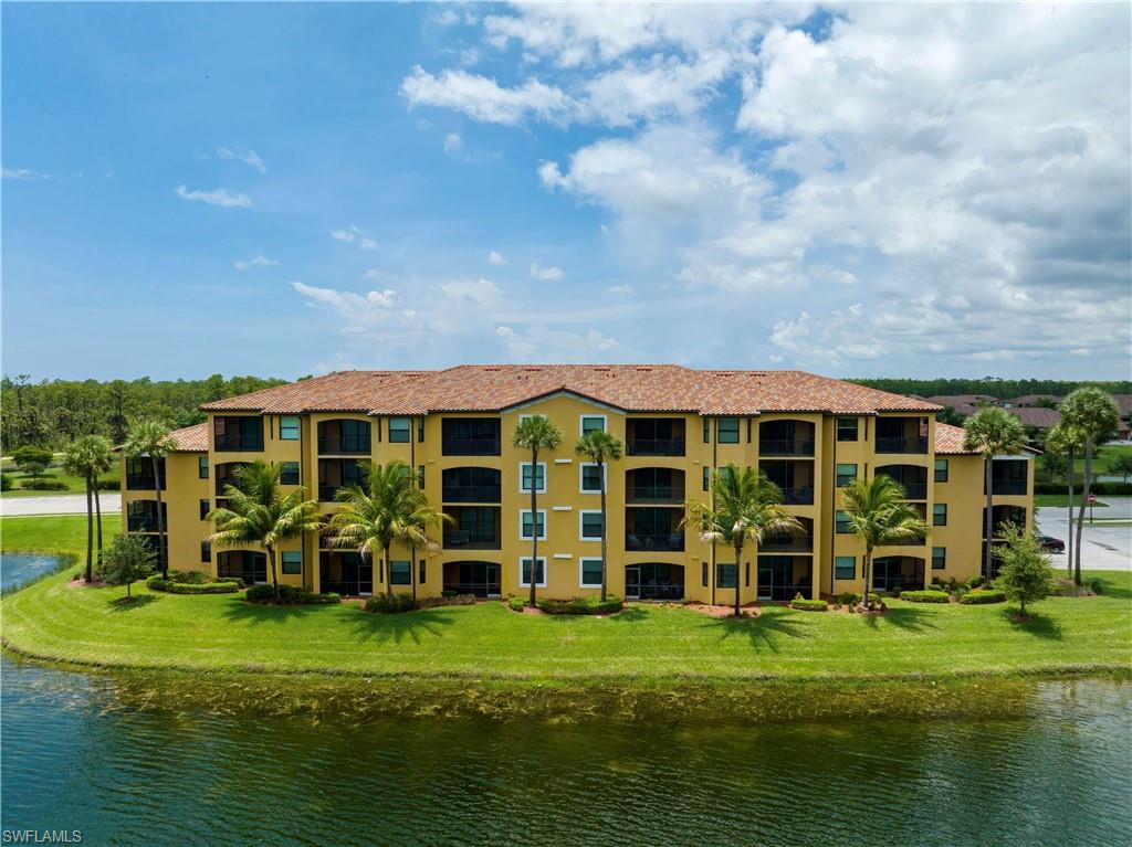 9560 Trevi Court, Unit 4815 Naples, FL 34113 - Photo 23 of 38 a front view of a house with a yard
