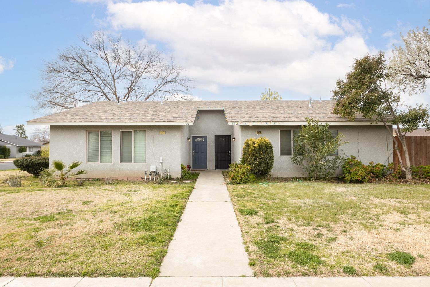 2242 Harvard Avenue Clovis, CA 93612 - Photo 1 of 34 a view of a house with a swimming pool