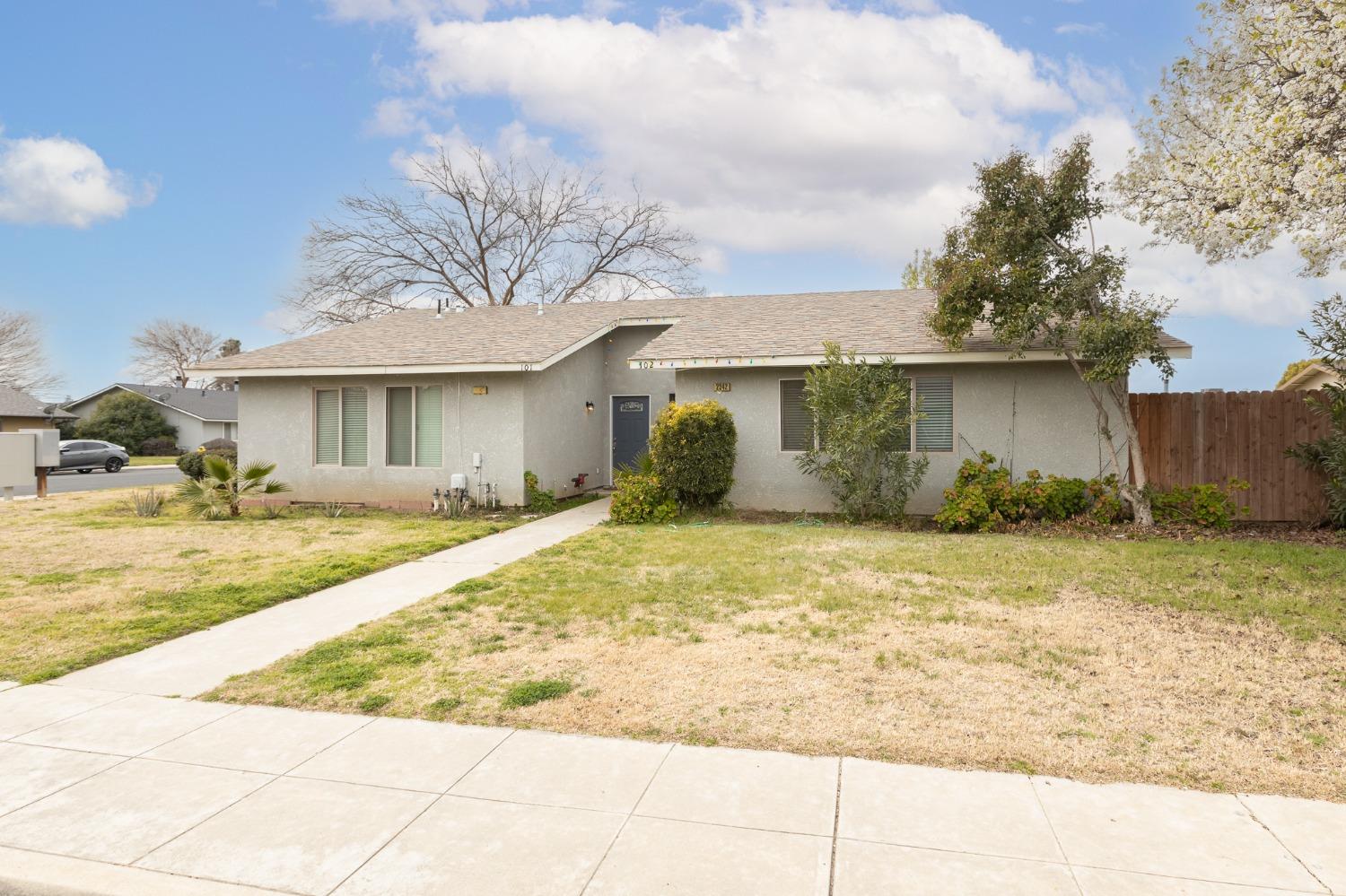 2242 Harvard Avenue Clovis, CA 93612 - Photo 2 of 34 a view of a house with backyard and sitting area