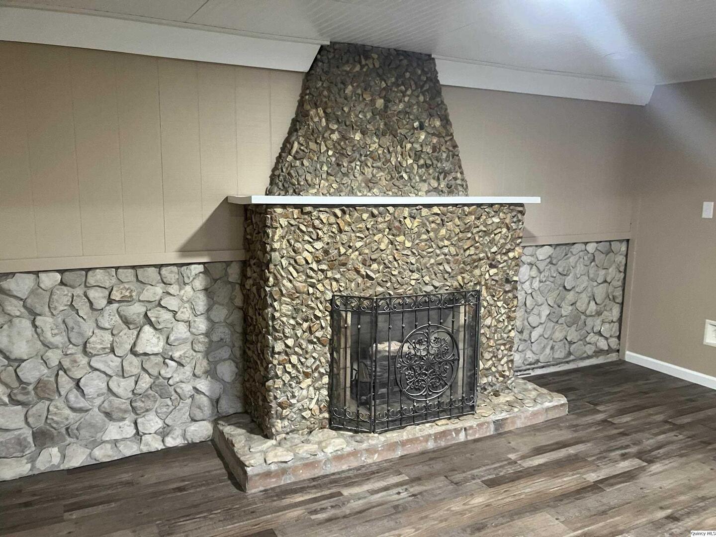 2525 Larch Road Quincy, IL 62301 - Photo 17 of 21 a living room with a fireplace