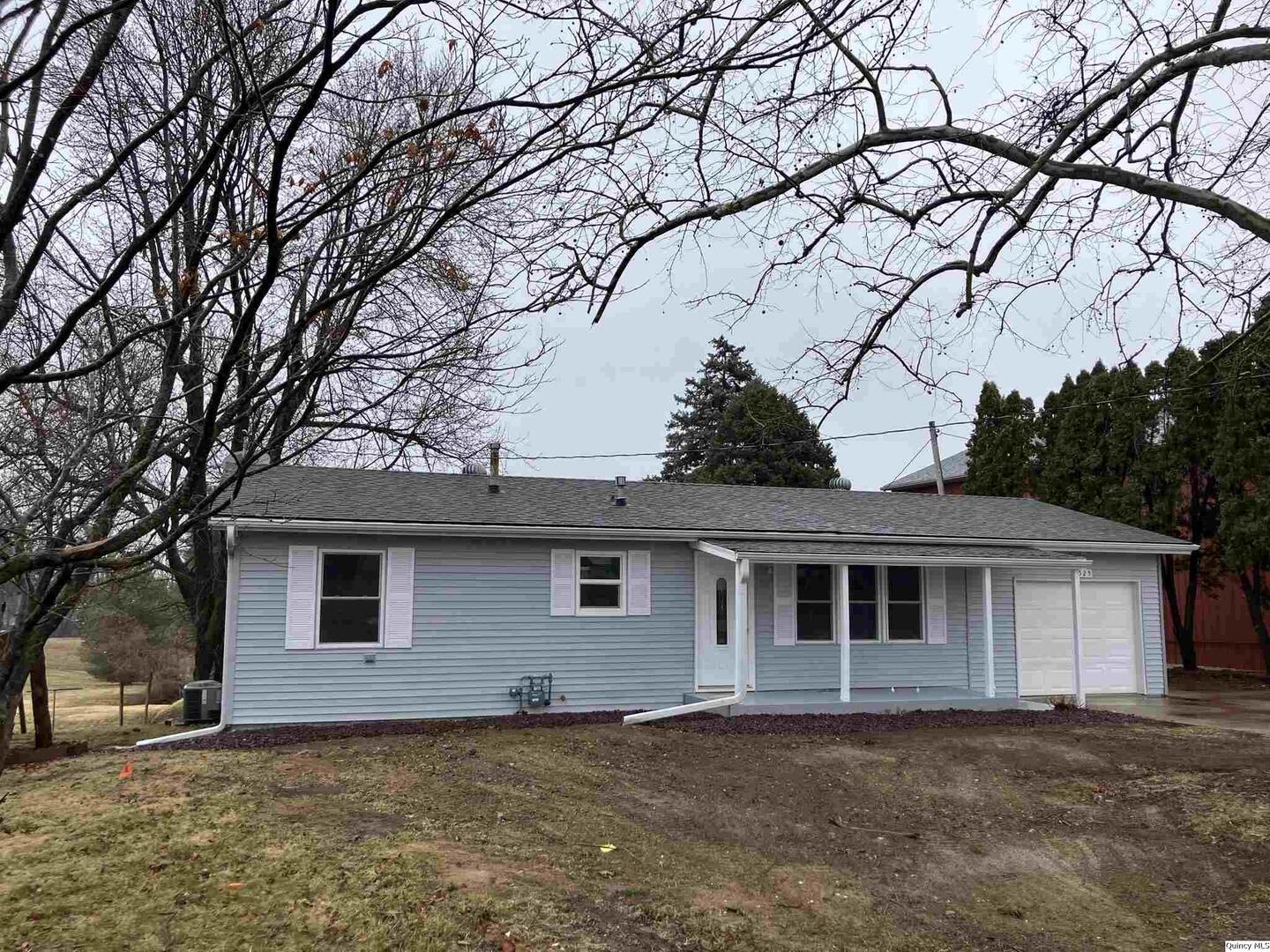 2525 Larch Road Quincy, IL 62301 - Photo 20 of 21 a front view of a house with a tree