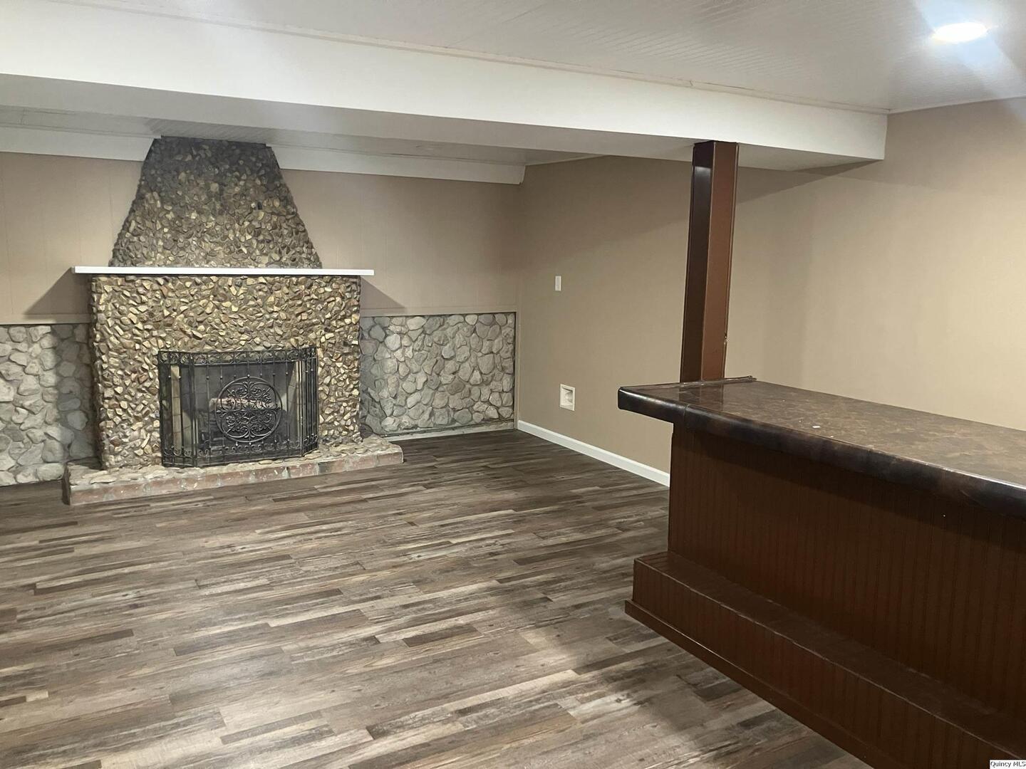 2525 Larch Road Quincy, IL 62301 - Photo 5 of 21 wooden floor fireplace and natural light