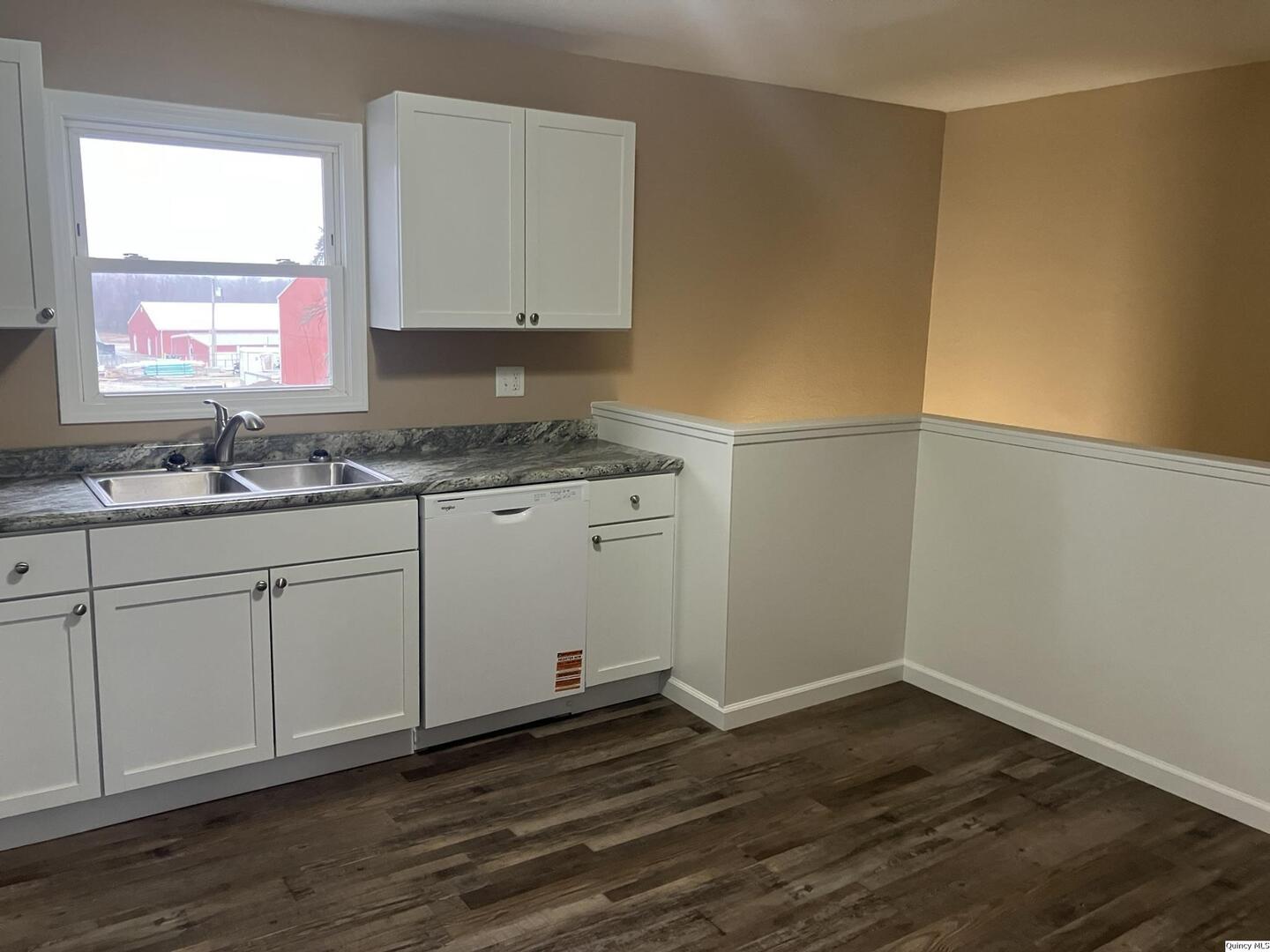 2525 Larch Road Quincy, IL 62301 - Photo 7 of 21 a kitchen with a sink cabinets and wooden floor