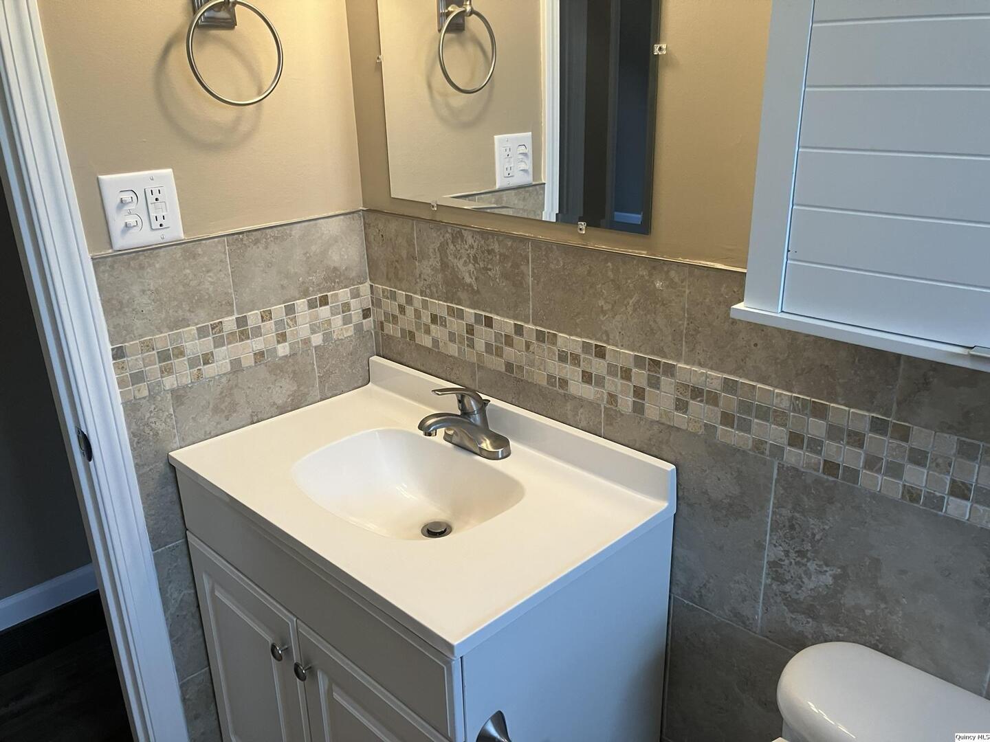 2525 Larch Road Quincy, IL 62301 - Photo 9 of 21 a bathroom with a sink mirror vanity and toilet