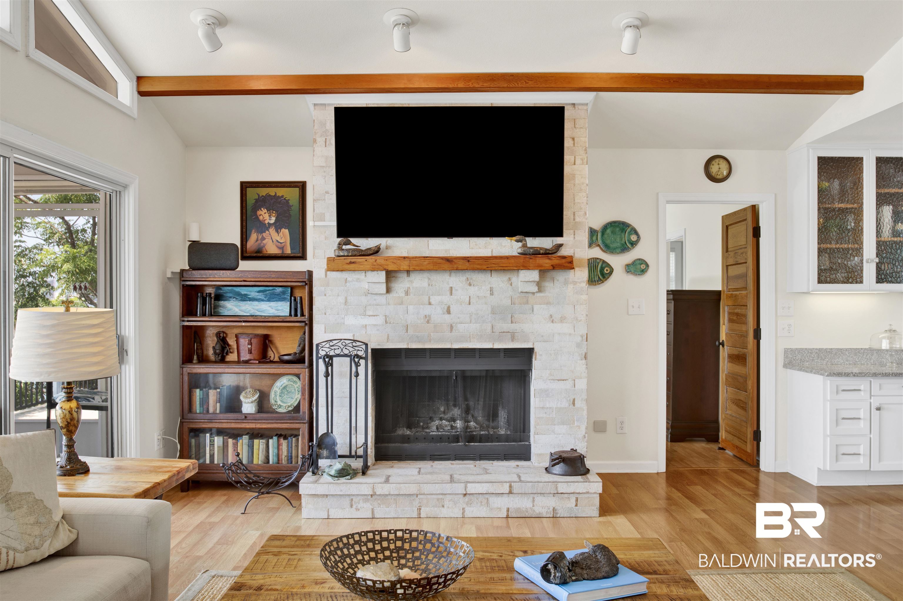 30538 River Road Orange Beach, AL 36561 - Photo 21 of 78 Living area with wood finished floors and a large fireplace