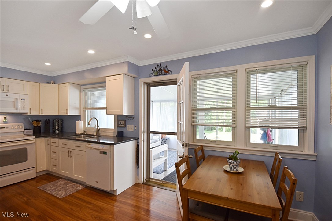 1388 Ford Road Lyndhurst, OH 44124 - Photo 21 of 39 Kitchen with ceiling fan, crown molding, dark hardwood / wood-style flooring, and white appliances