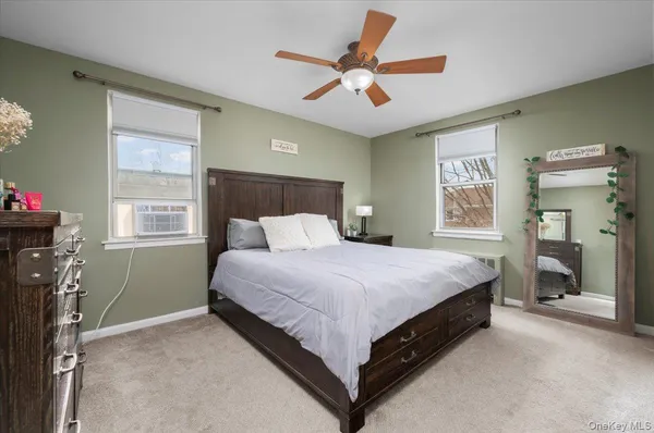 a bed room with a bed and a window