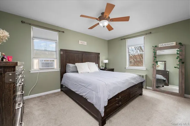 a bed room with a bed and a window