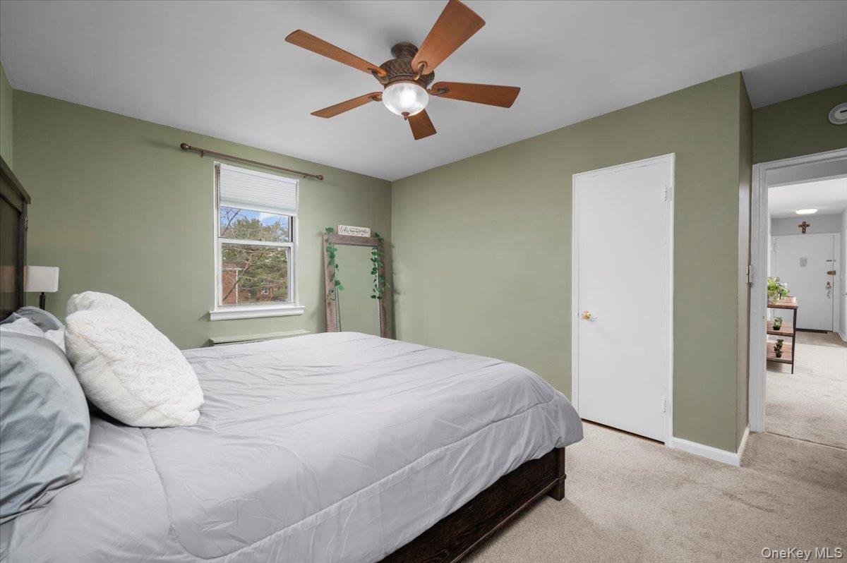 13 Bryant Crescent, Unit 2K White Plains, NY 10605 - Photo 15 of 29 a bedroom with a bed and a window