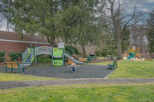 a view of a park with swings and slides