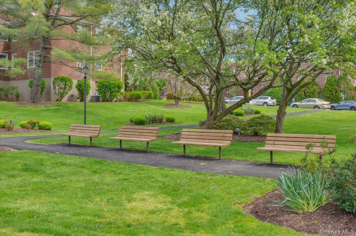 13 Bryant Crescent, Unit 2K White Plains, NY 10605 - Photo 27 of 29 a view of a park with bench and trees