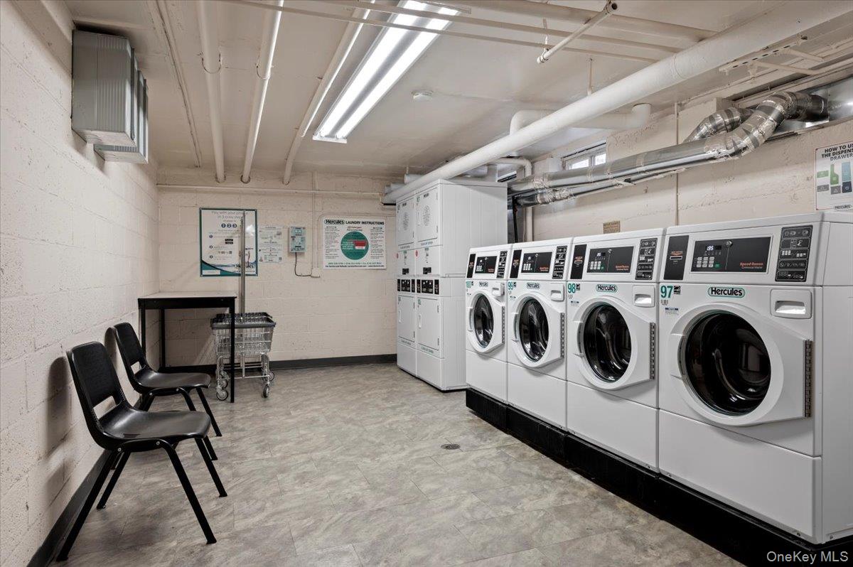 13 Bryant Crescent, Unit 2K White Plains, NY 10605 - Photo 28 of 29 a utility room with dryer washer and stair