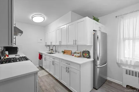 a kitchen with cabinets and appliances