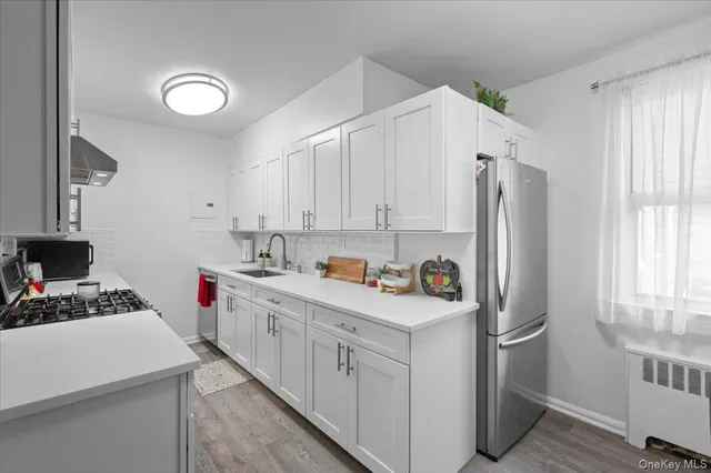 a kitchen with cabinets and appliances