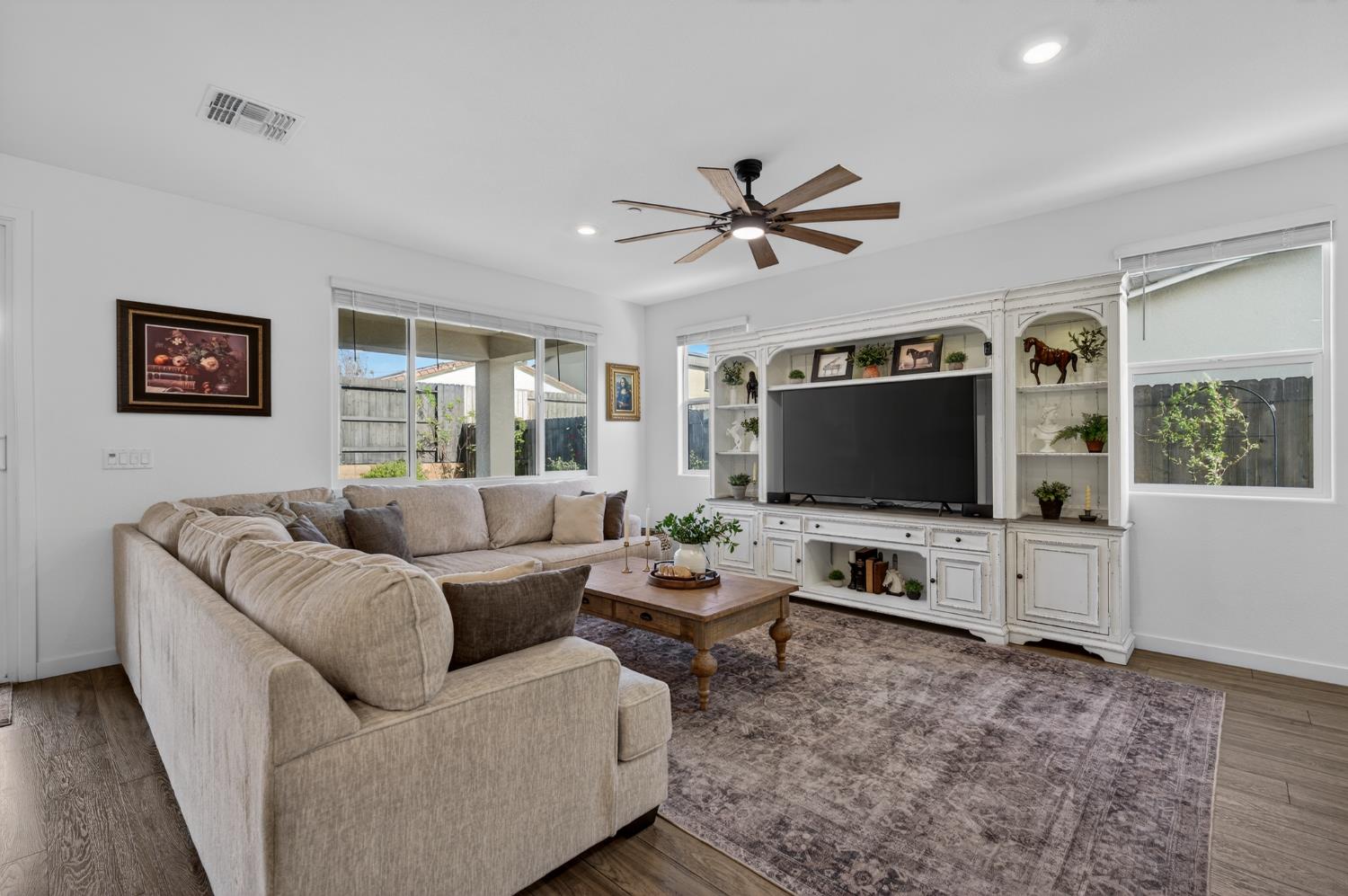 4498 Duckhawk Circle Rancho Cordova, CA 95742 - Photo 12 of 61 a living room with furniture and a flat screen tv