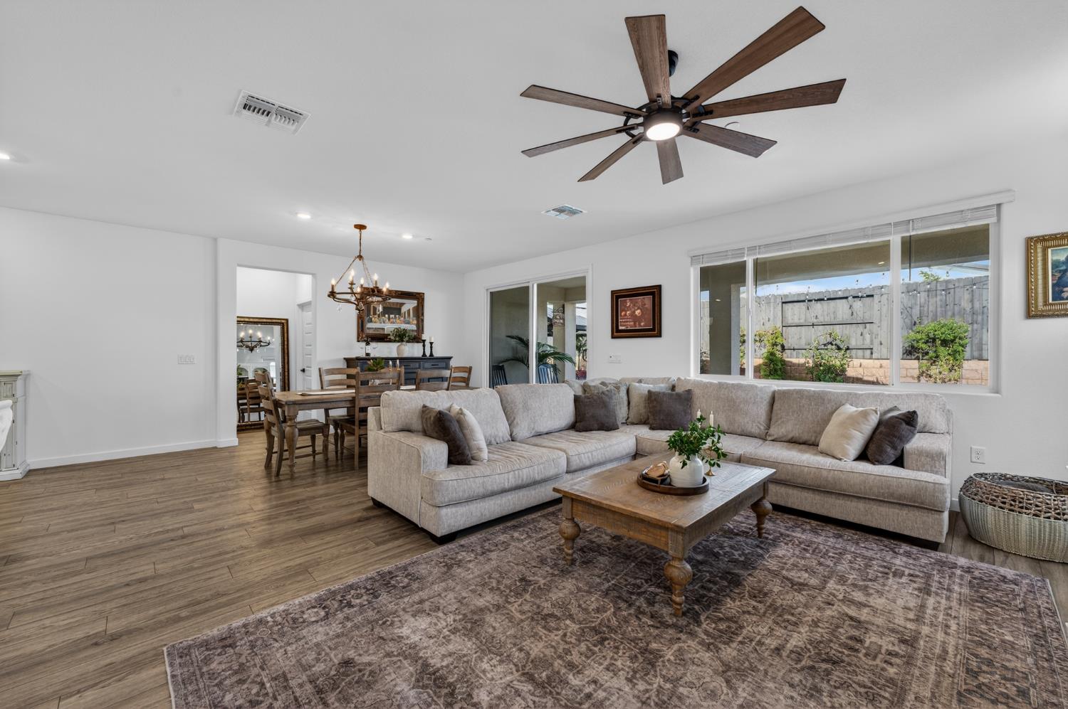 4498 Duckhawk Circle Rancho Cordova, CA 95742 - Photo 13 of 61 a living room with furniture ceiling fan and a rug