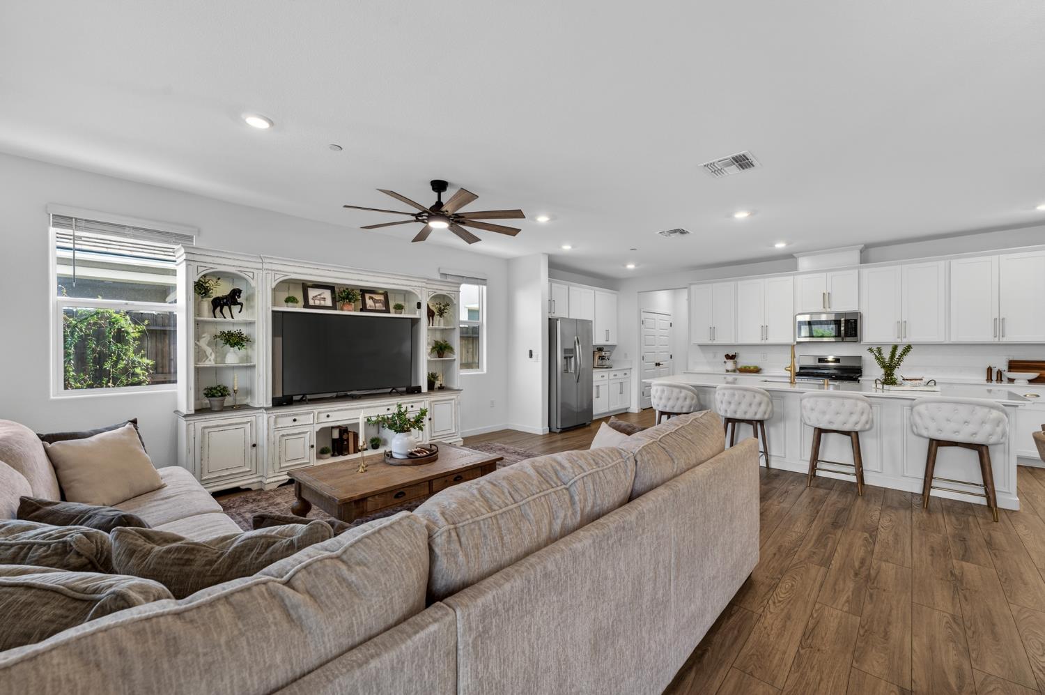 4498 Duckhawk Circle Rancho Cordova, CA 95742 - Photo 14 of 61 a living room with furniture kitchen view and a flat screen tv